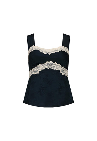 A black camisole top with wide shoulder straps, featuring a textured jacquard fabric and a double band of cream lace trim across the bust and waist, shown against a plain white background.