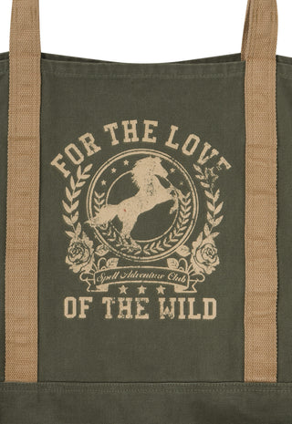 An olive green canvas tote bag with tan webbing handles and a beige graphic print featuring a horse and the text 'FOR THE LOVE OF THE WILD' and 'Wild Adventure Club'.